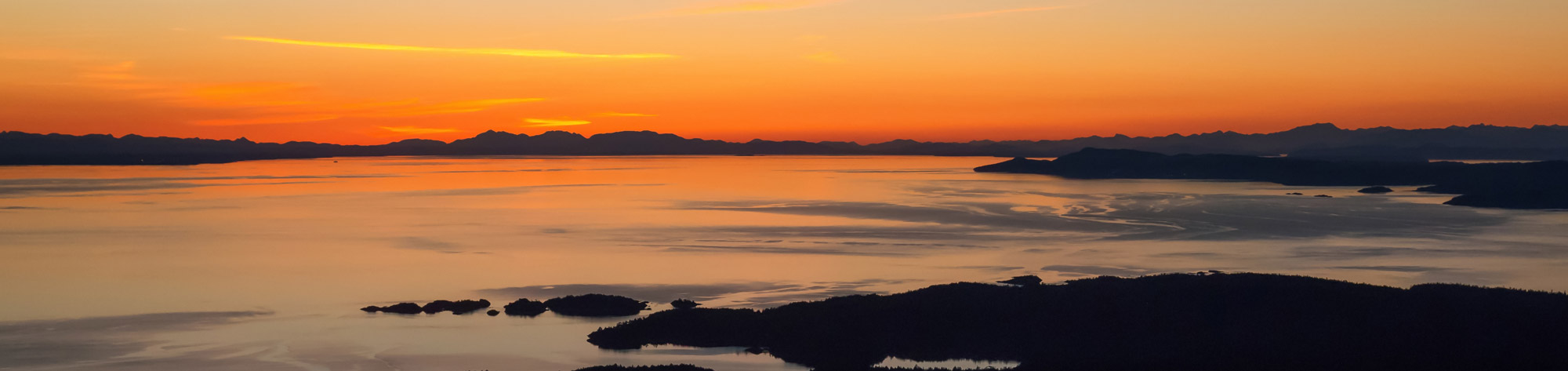Silhouette landscape view of Lasqueti Island in Strait of Georgia North West from Vancouver, British Columbia, Canada